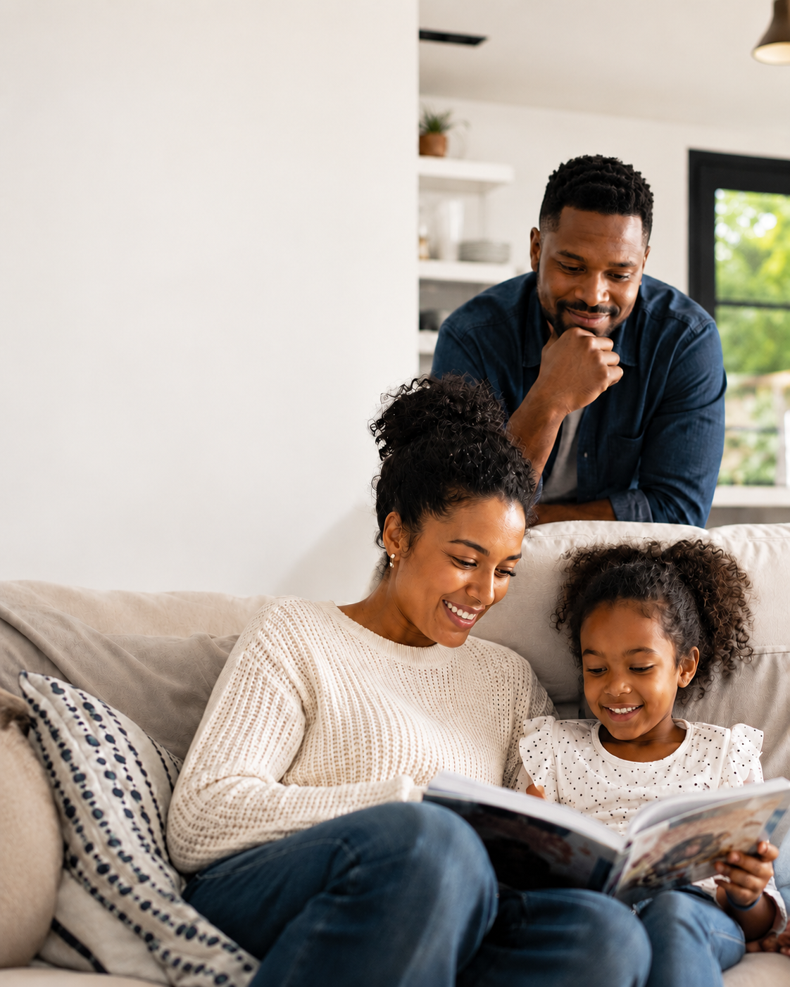 A South African family reading together on the couch